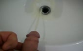 Nude Woman Pisses in Bathroom and Squirts Down Her Pussy