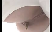 Girl shitting in a bowl, turd drops slow