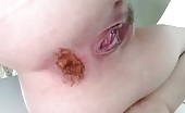Guy shitting huge brown turd on white surface