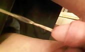 Man pissing with a long stream into his hand